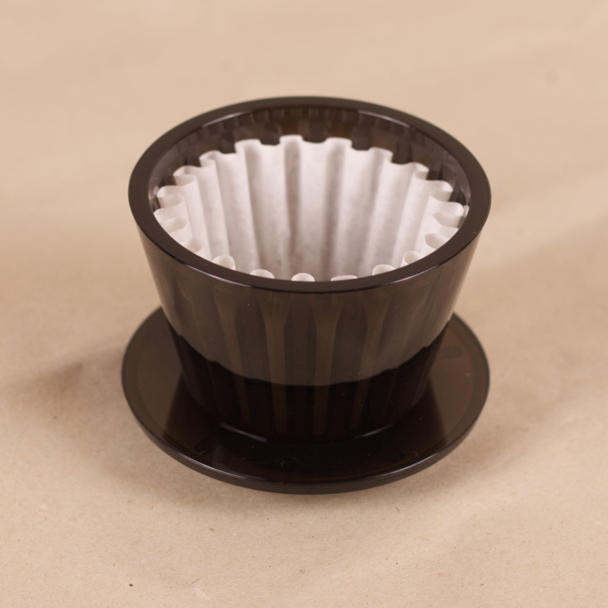 Der Crystal Eye Filterträger von der Seite mit eingesetztem Filterpapier.